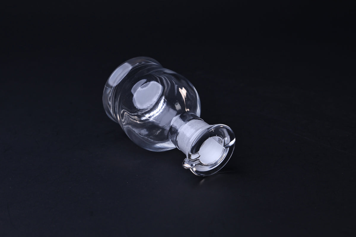 Hirota Glass soy sauce cruet — tilted view showing ground glass stopper and pouring spout
