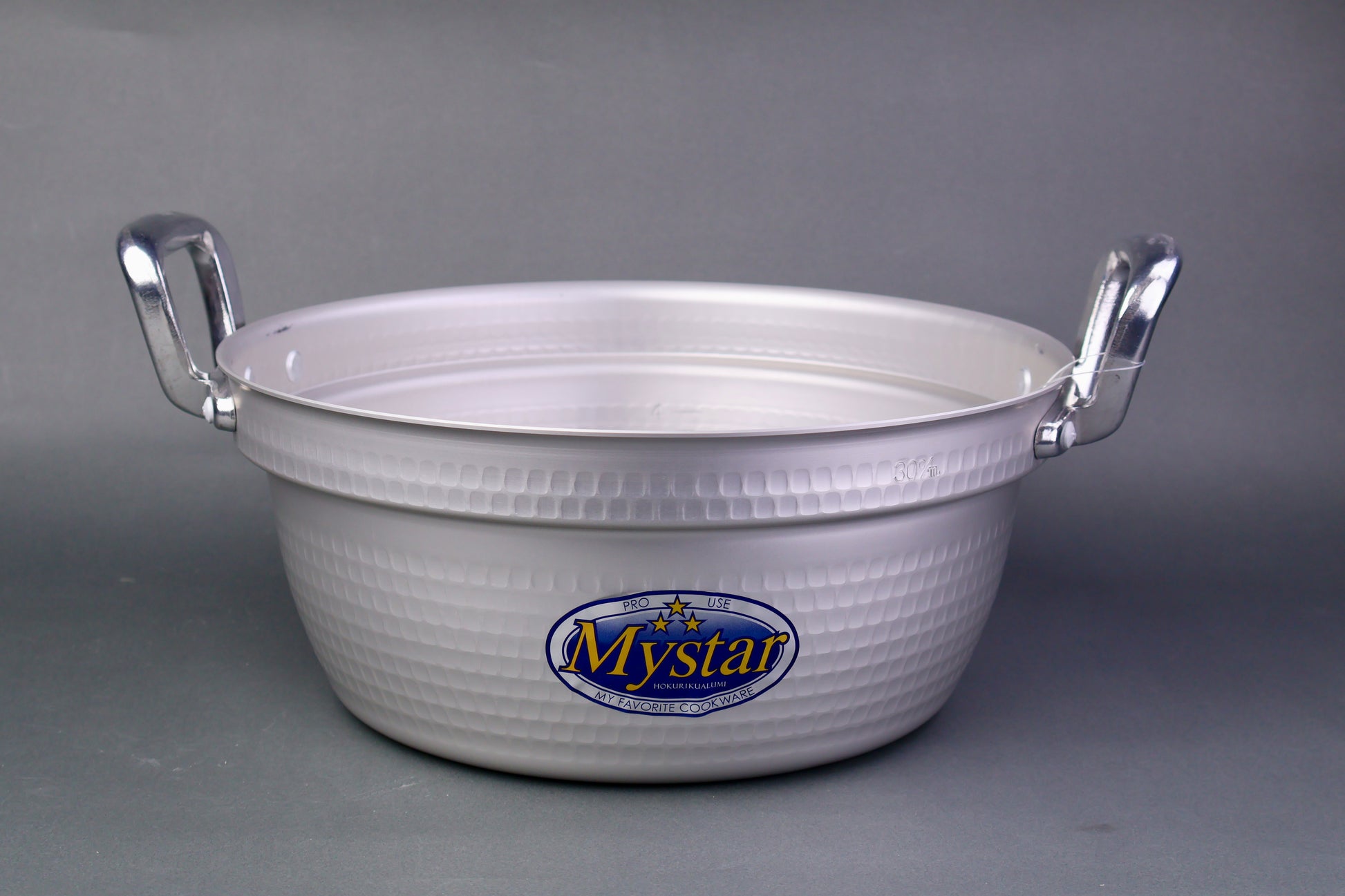 two handled silver grey cooking pot for steamed food with sticker on pot face in grey backdrop