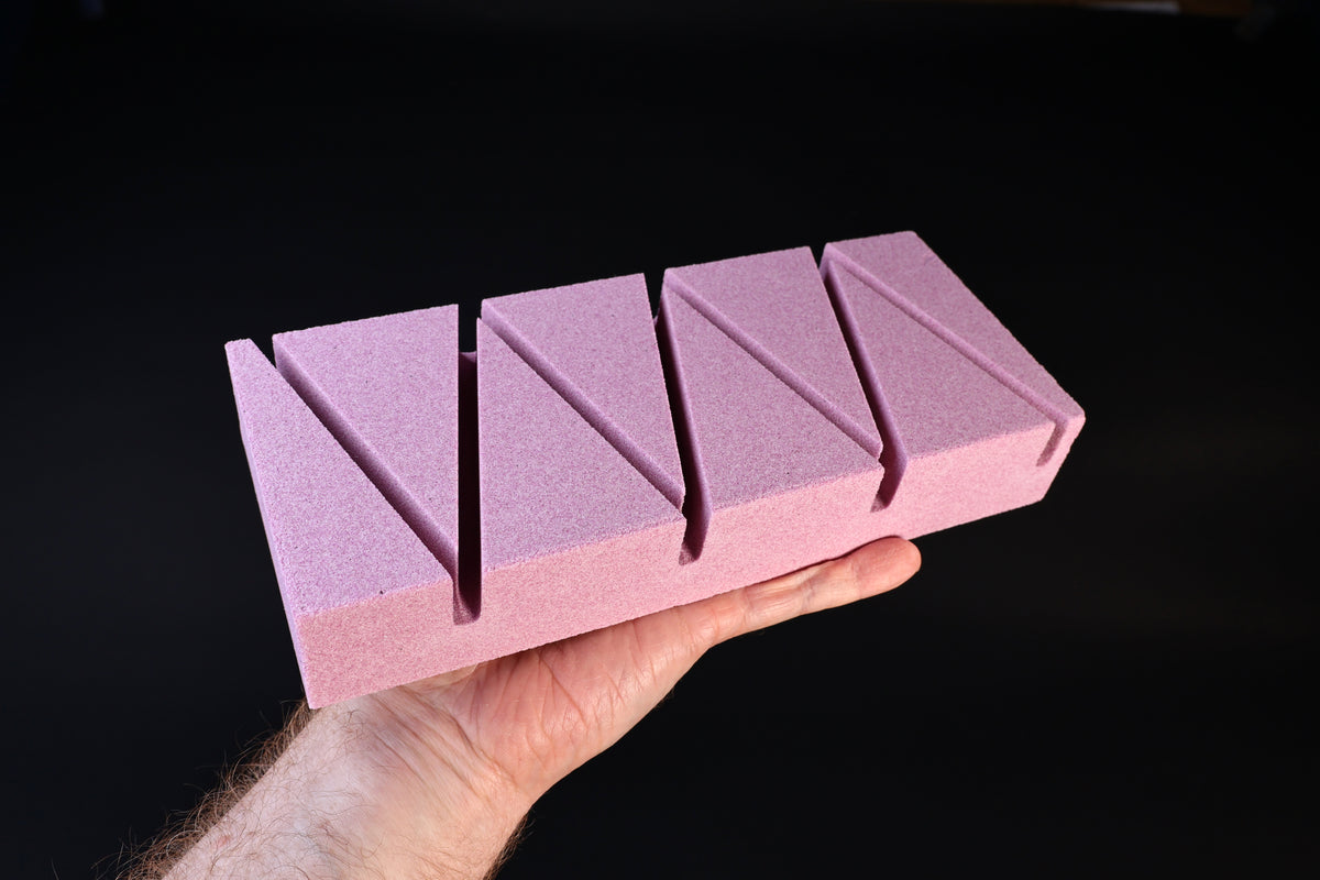 Imanishi Suiheikun Flattening Stone Large — close angled view showing V-groove depth and abrasive texture