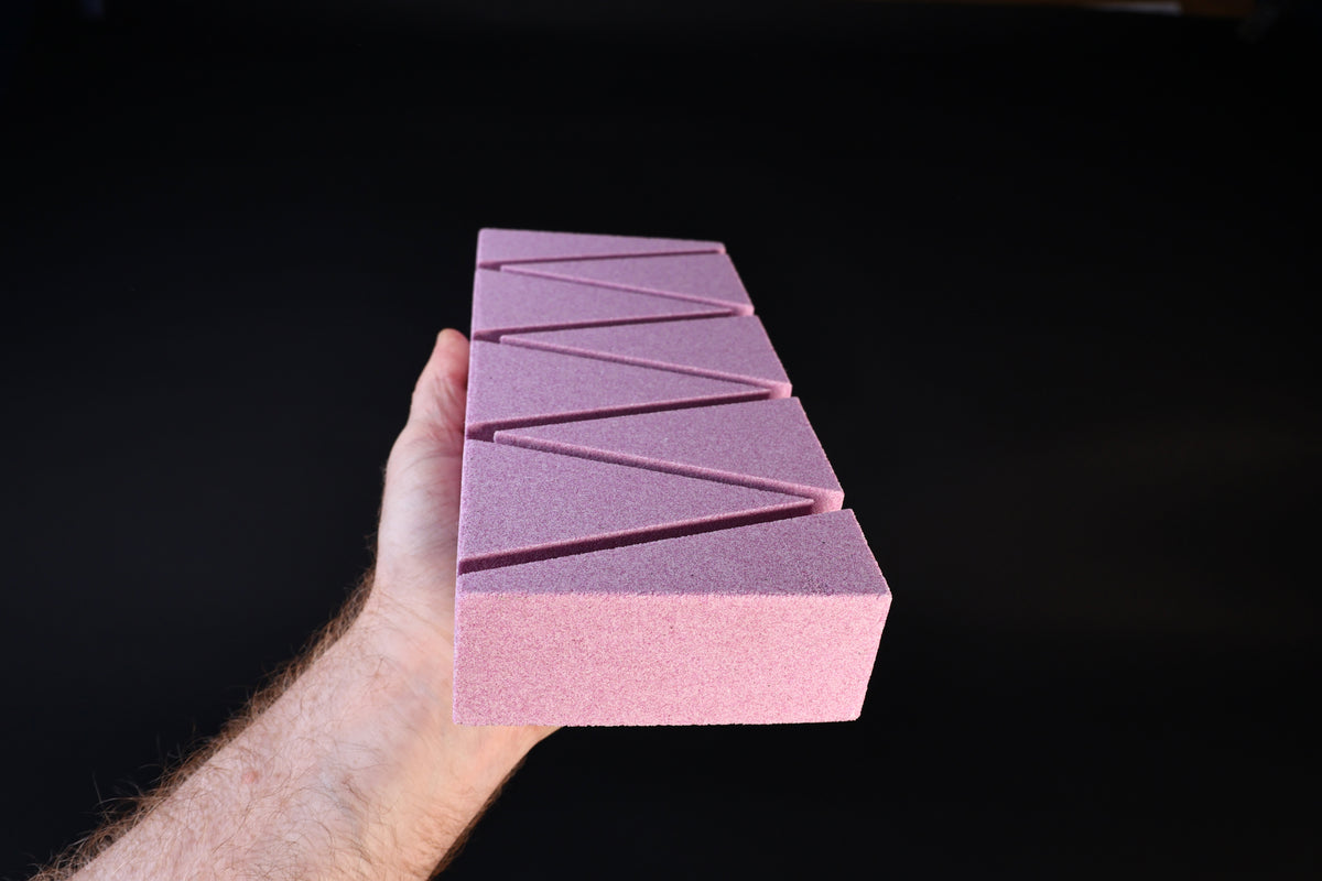 Imanishi Suiheikun Flattening Stone Large — angled view of zigzag groove pattern across abrasive surface