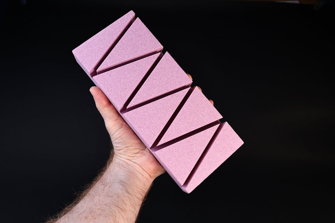 Imanishi Suiheikun Flattening Stone Large in hand showing abrasive surface and groove pattern
