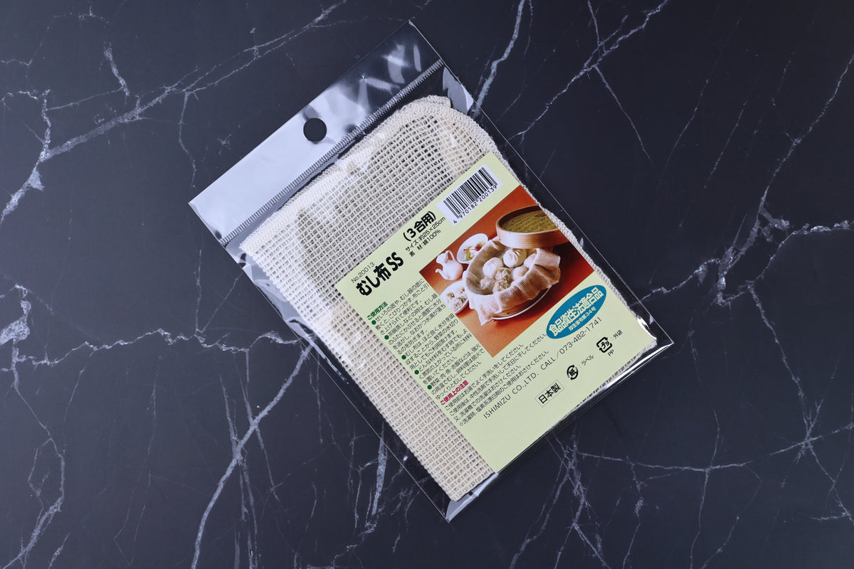 Ishimizu steamer cloth SS 25x25cm packaging angled, showing open-weave cotton cloth texture through clear plastic