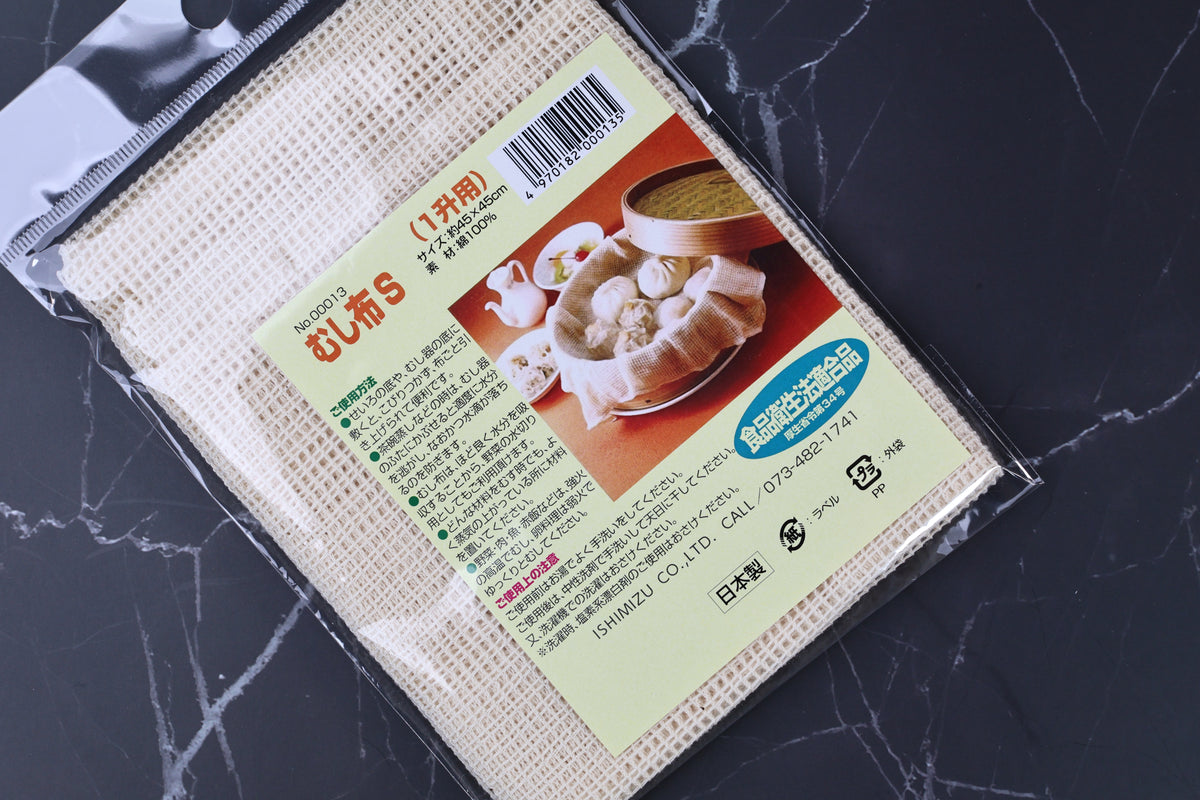 Ishimizu steamer cloth packaging close angled view, label and open-weave cotton cloth texture clearly visible