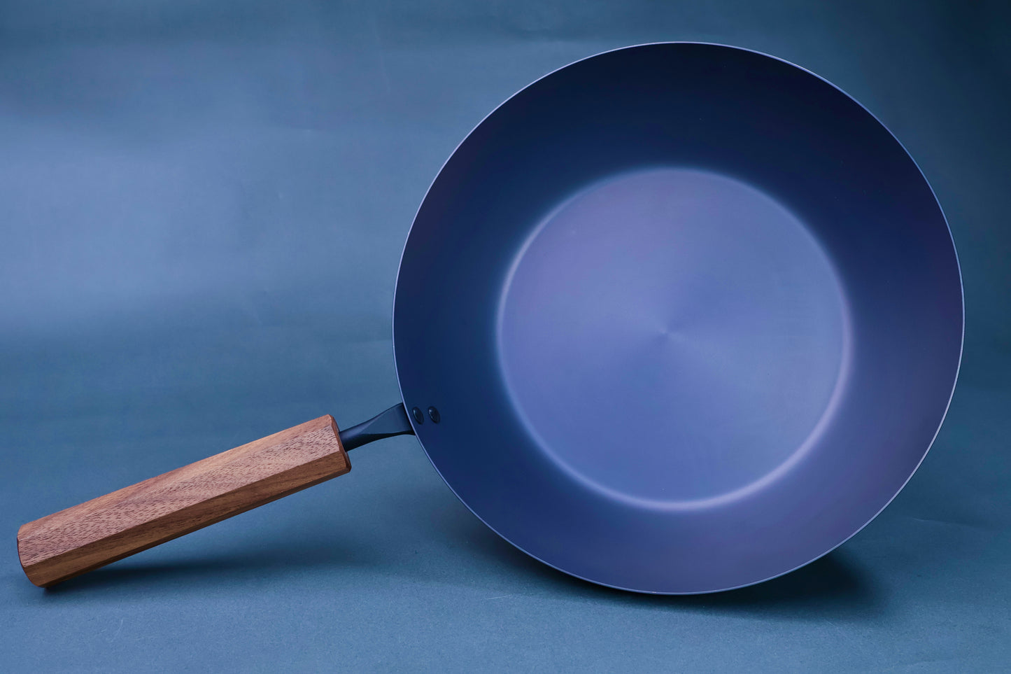 Japanese carbon steel nitride deep fry pan 24cm front view showing smooth nitrided interior and octagonal hardwood handle