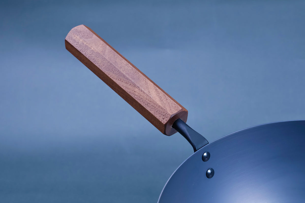 Octagonal hardwood handle detail on a Japanese carbon steel nitride deep fry pan 24cm