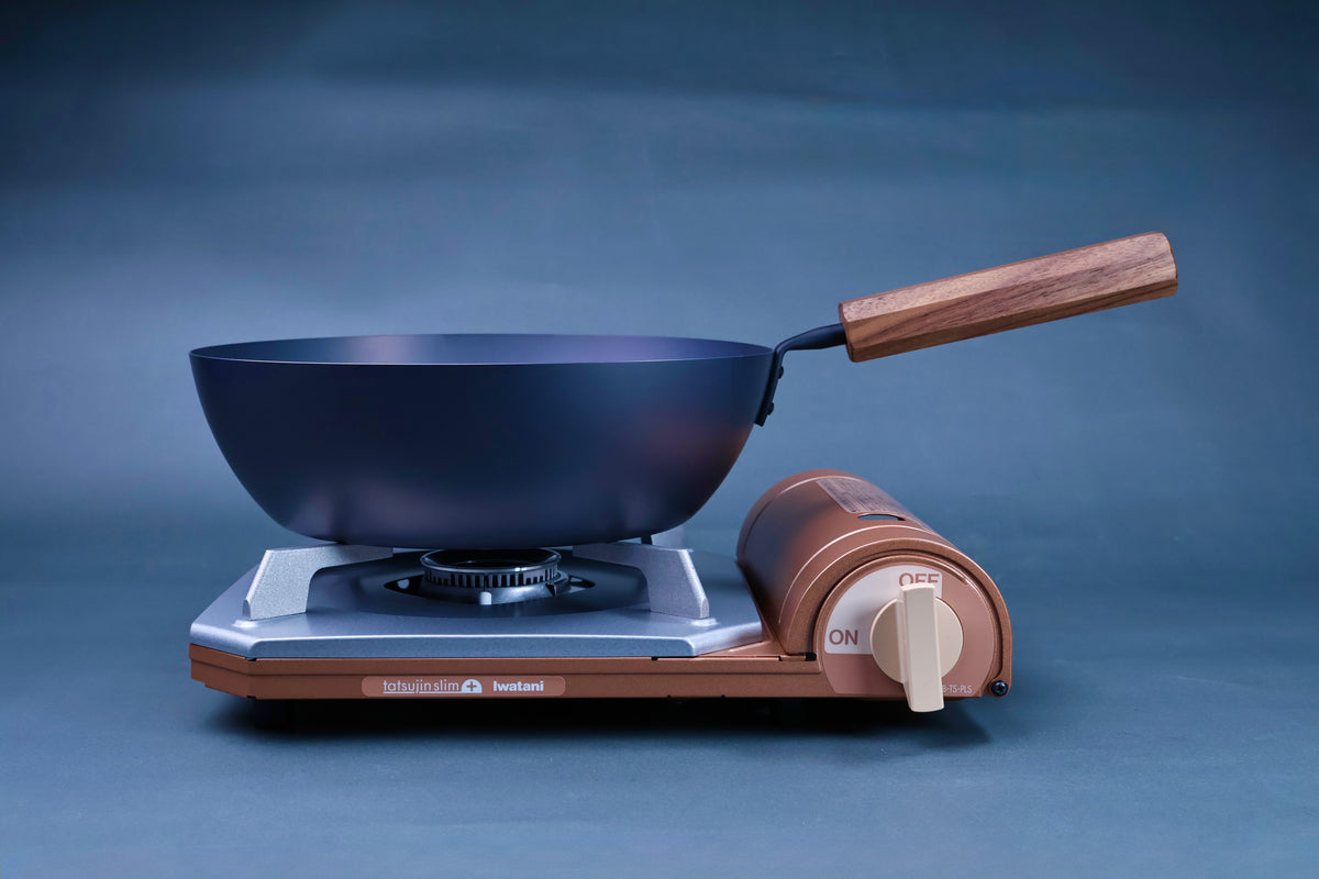 Japanese carbon steel nitride deep fry pan 24cm with octagonal hardwood handle on an Iwatani portable gas burner