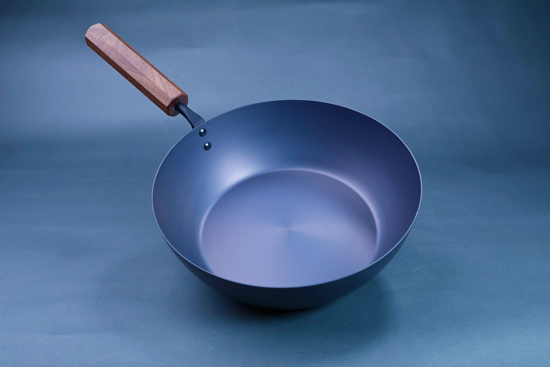 Octagonal hardwood handle detail on a Japanese carbon steel nitride deep fry pan 24cm