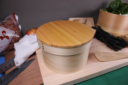 wappa ohitsu rice chest with lid atop cutting board with rice scoop and japanese cookware 