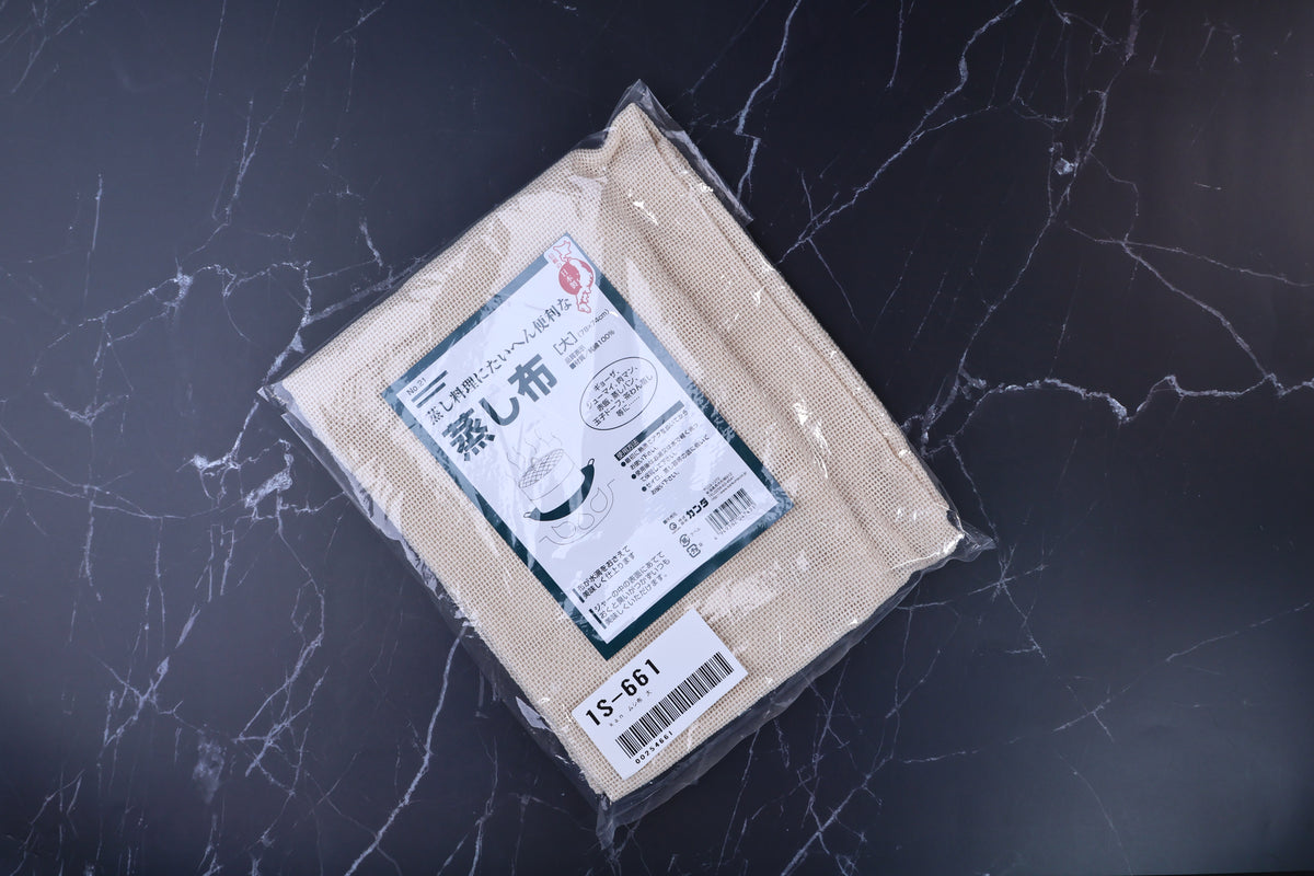 Kanda steamer cloth 78x74cm overhead view, open-weave cotton texture visible through packaging