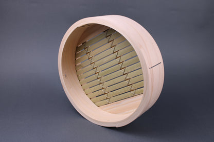 frontal interior shot base of bamboo kiso hinoki steamer extra thick walls bamboo slats wrapped with stainless steel wire for durability in grey backdrop