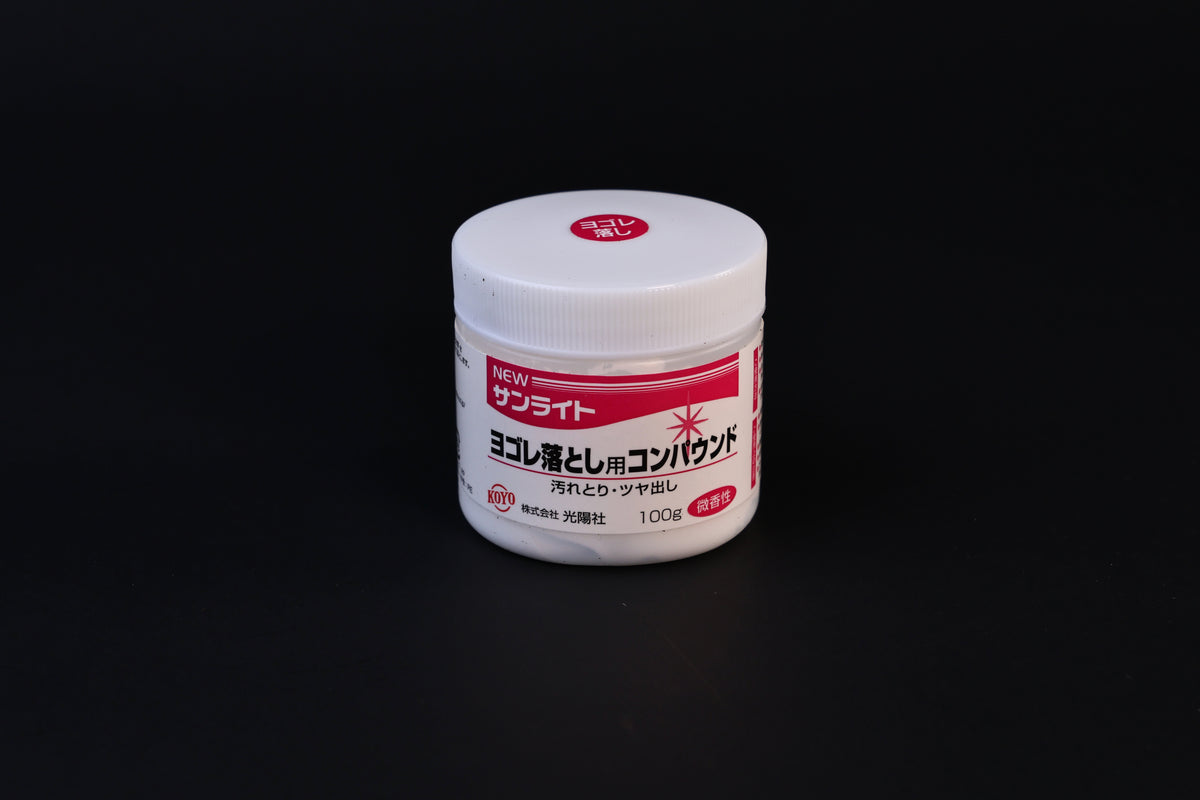 Koyo New Sunlite dirt-removing polishing compound 100g jar with red label shown front-on against a dark background