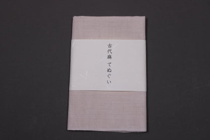 okai mafu linen towel tenugui neatly folded wrapped with fine paper showcasing company name