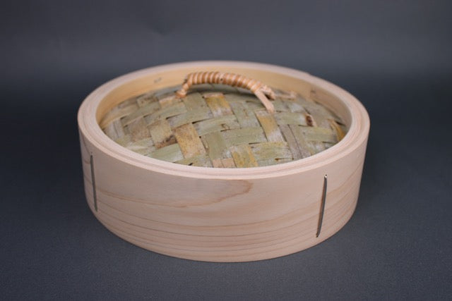 bamboo steamer lid 24cm made of kiso hinoki woven bamboo tightly wrapped rattan handle with grey background