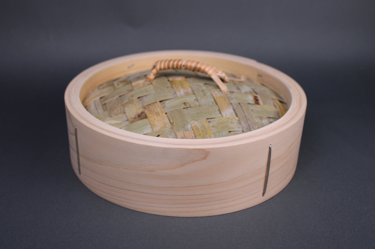 bamboo steamer lid 24cm made of kiso hinoki woven bamboo tightly wrapped rattan handle with grey background