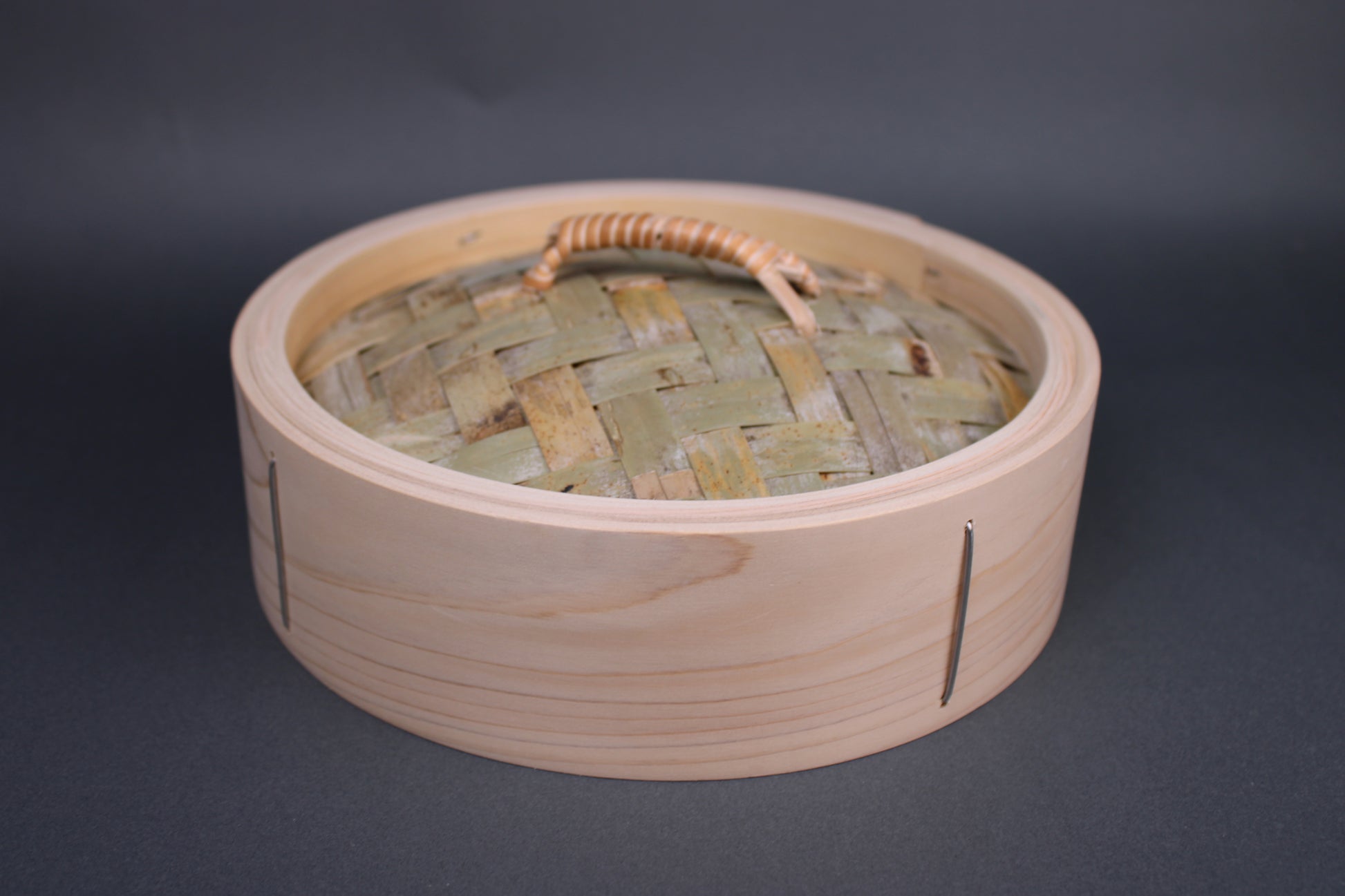 bamboo steamer lid 24cm made of kiso hinoki woven bamboo tightly wrapped rattan handle with grey background