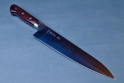 Masamoto CT carbon steel gyuto 240mm full view with rosewood handle on grey background