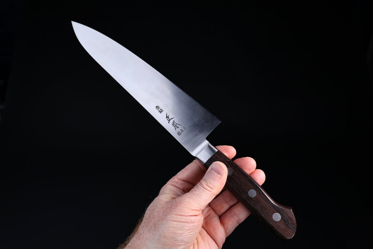 Masamoto CT Carbon Steel Gyuto 240mm Japanese chef knife in hand showing full blade profile