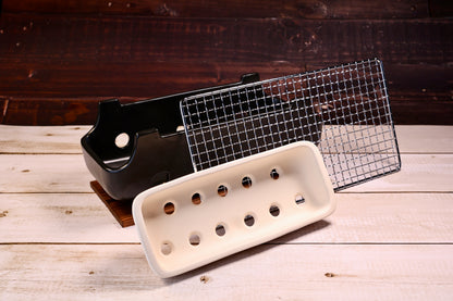 Misuzu Pottery Banko Yaki Konro Grill, disassembled showing black ceramic body, white clay ash catcher, and wire grate