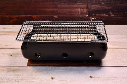 Misuzu Pottery Banko Yaki Konro Grill, assembled front view on wood plank showing full ceramic body and stainless grate