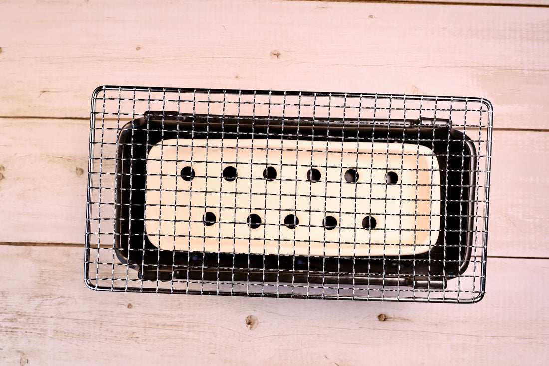 Misuzu Pottery Banko Yaki Konro Grill, overhead view of stainless wire grate with ceramic ash catcher holes visible below