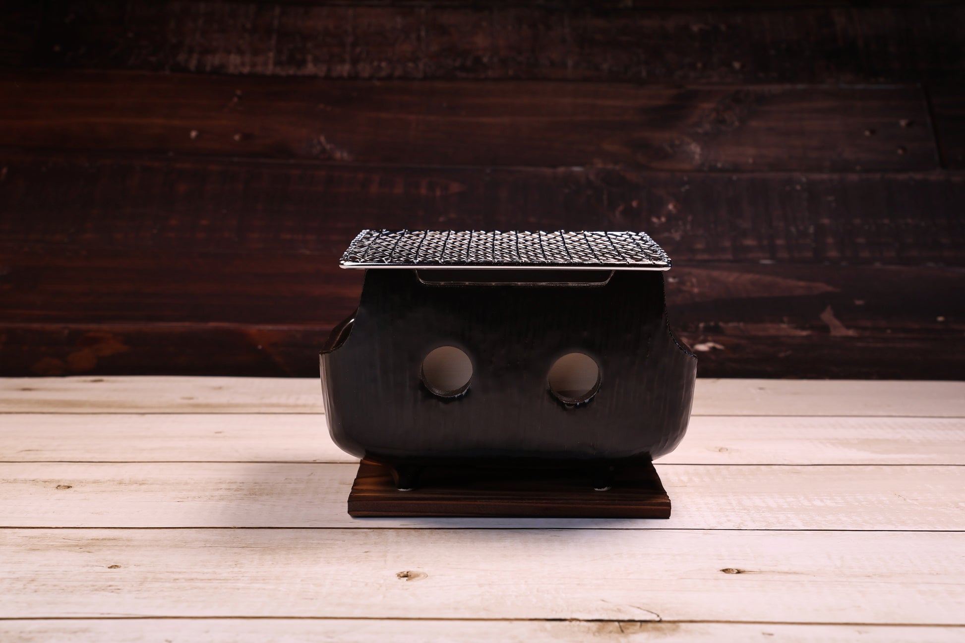 Misuzu Pottery Banko Yaki Konro Grill Small — front view of black glazed ceramic body and ventilation holes