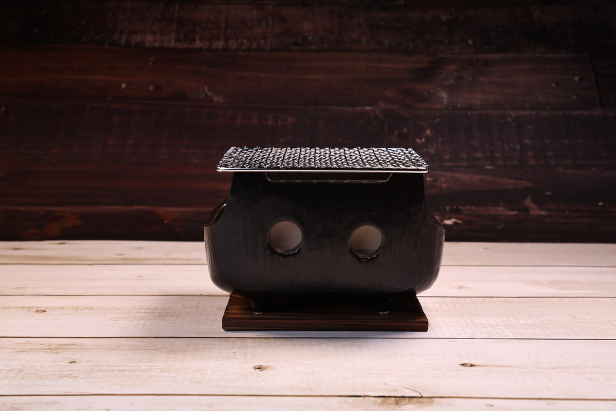 Misuzu Pottery Banko Yaki Konro Grill Small — front view of black glazed ceramic body and ventilation holes