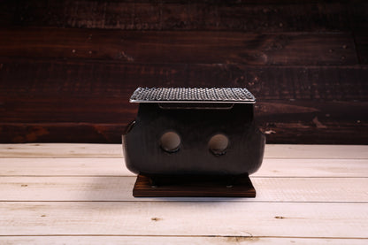 Misuzu Pottery Banko Yaki Konro Grill Small — front view of black glazed ceramic body and ventilation holes