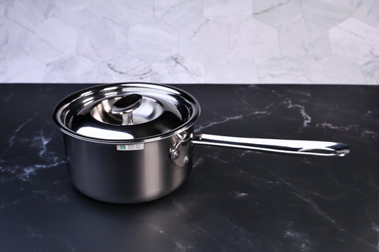 Mt. Fuji Steel Clad saucepan 16cm with stainless lid on black marble and white tile background