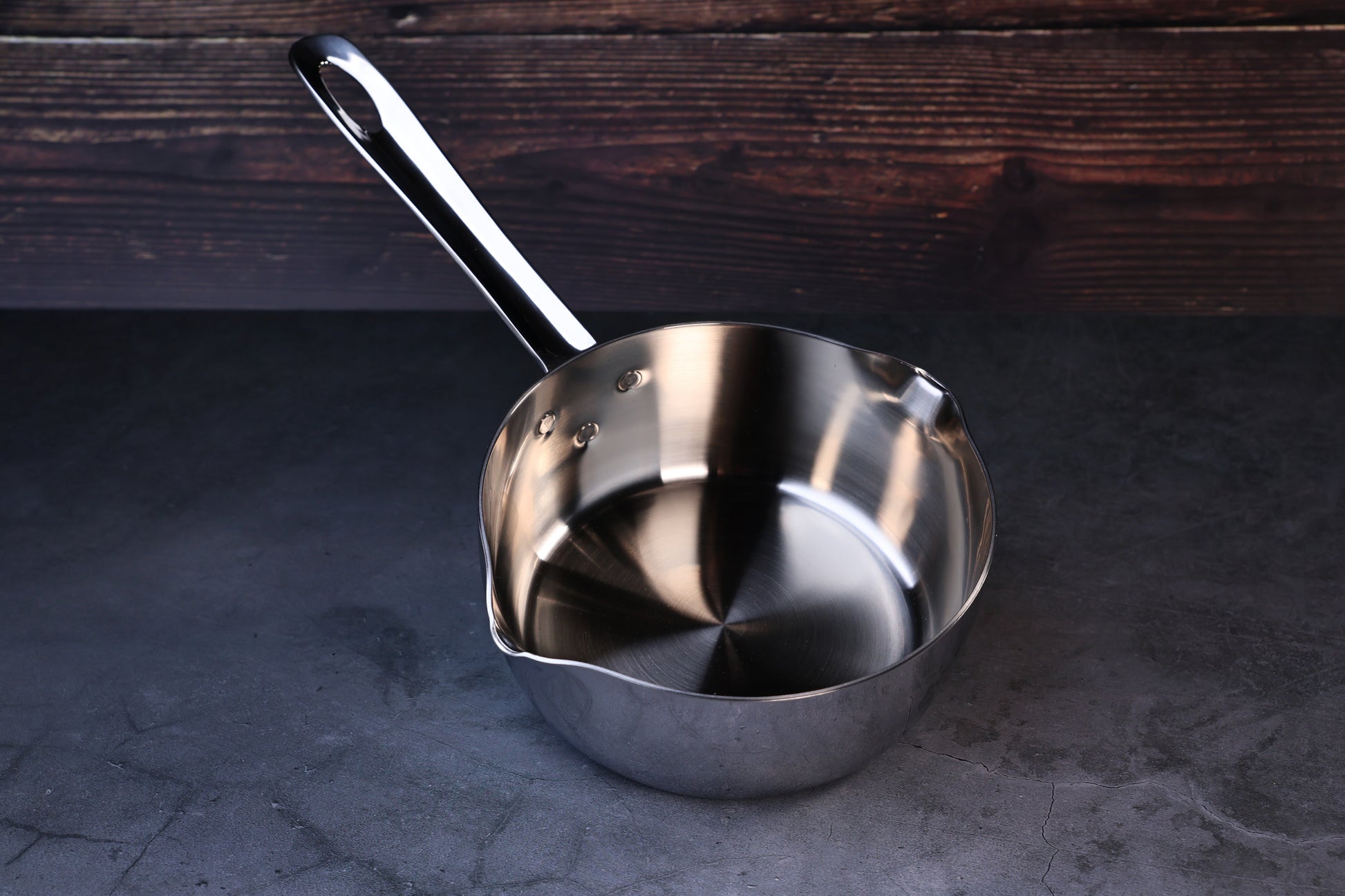 Mt. Fuji Steel Clad Yukihira saucepan 16cm on black marble showing interior, pour spouts, and full handle