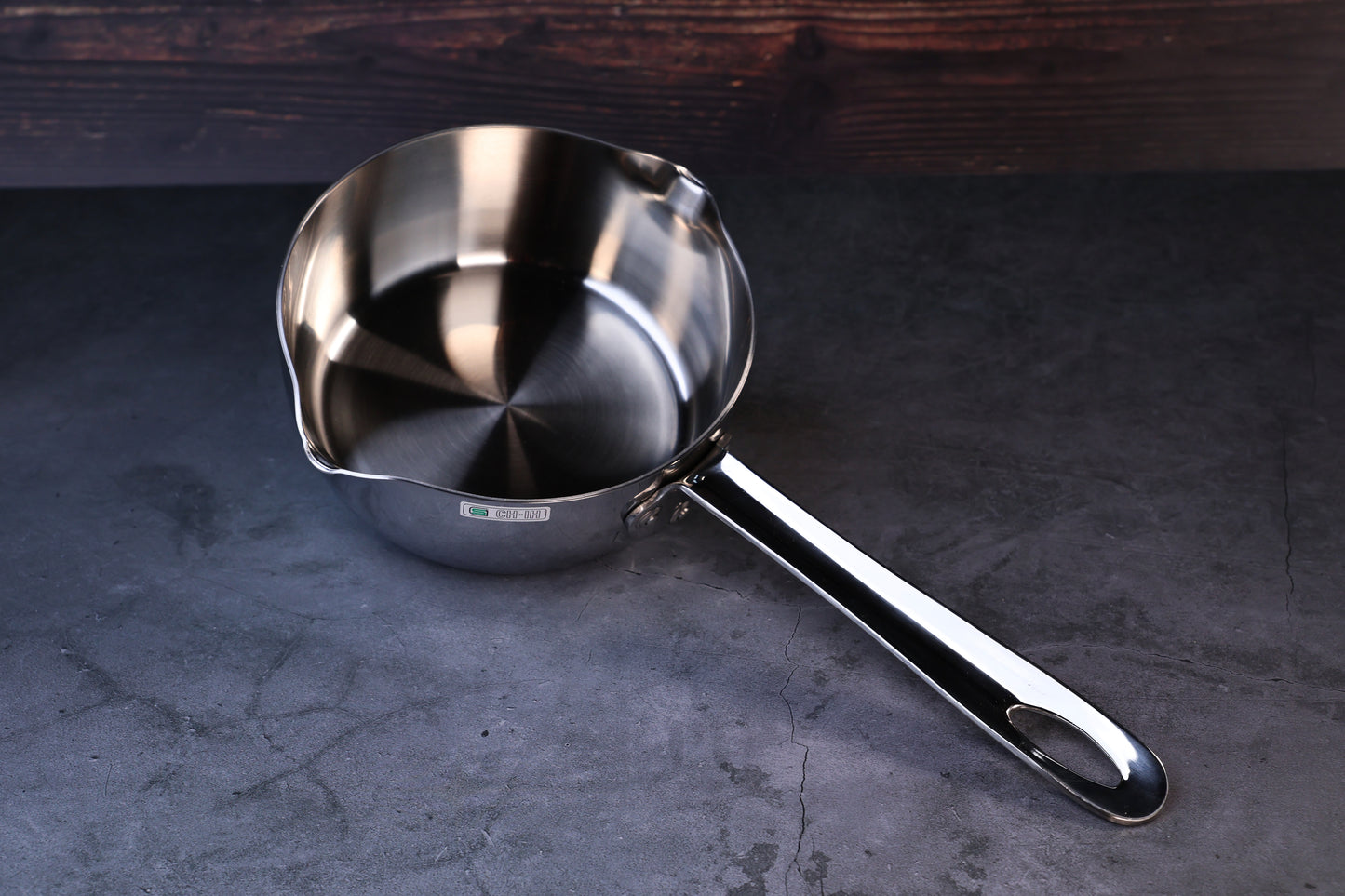 Mt. Fuji Steel Clad Yukihira saucepan 16cm held in hand showing exterior profile and brand label