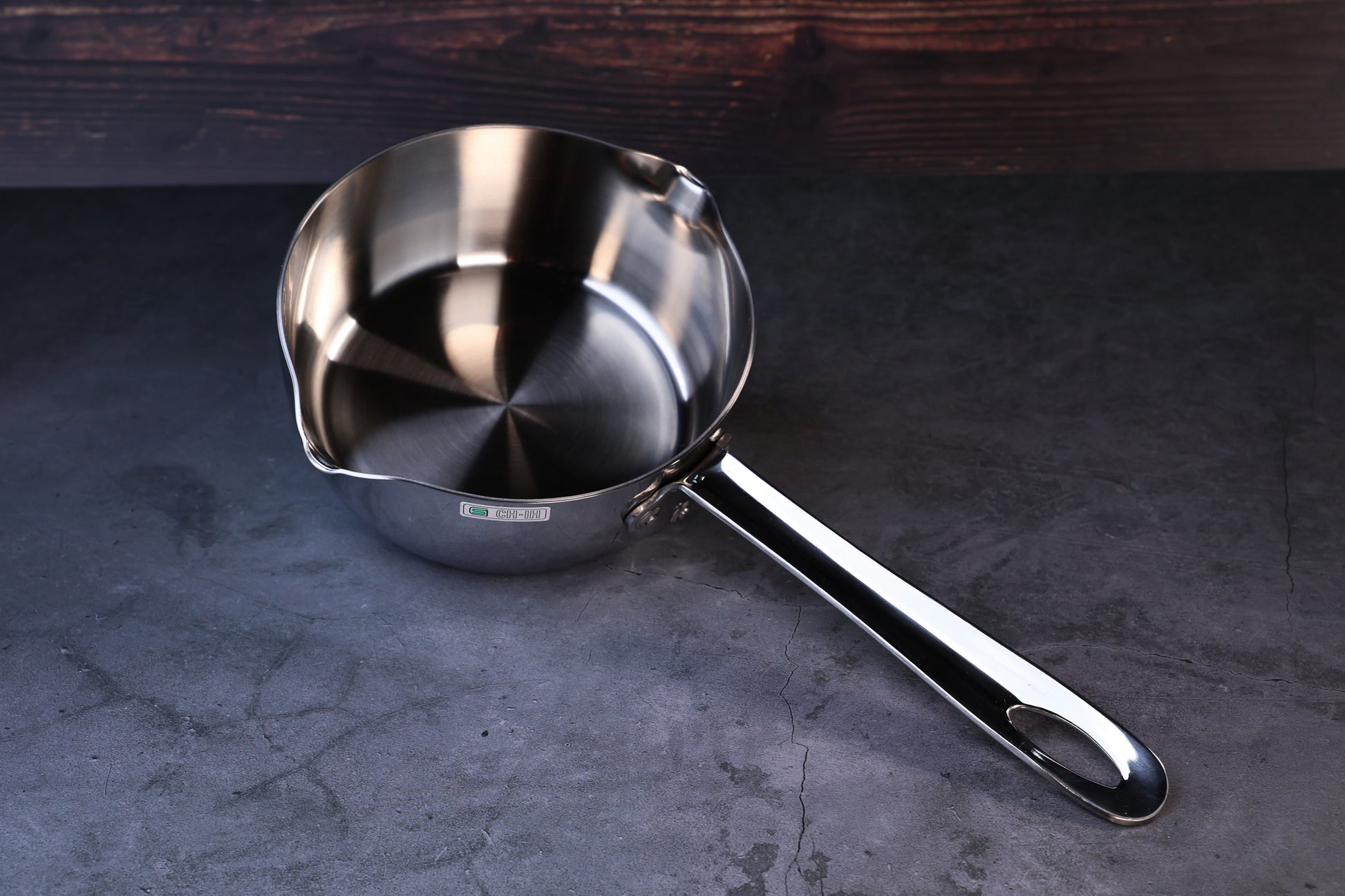 Mt. Fuji Steel Clad Yukihira saucepan 16cm held in hand showing exterior profile and brand label