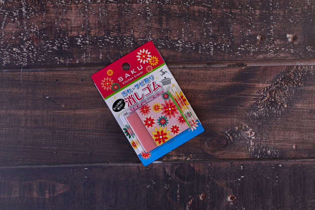 Naniwa Saku kitchen rust eraser — front of retail packaging showing pink abrasive eraser and floral card