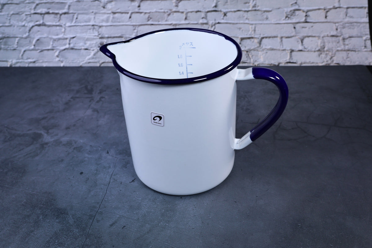 Noda Horo enamel measuring pitcher 2L — full side view showing white enamel body and cobalt blue handle