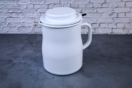 Noda Horo enamel oil pot — full side view with lid showing white enamel body and handle
