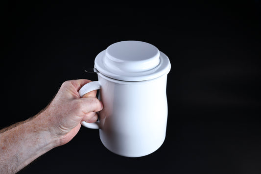 Noda Horo enamel oil pot — held by handle with lid on showing full assembled size