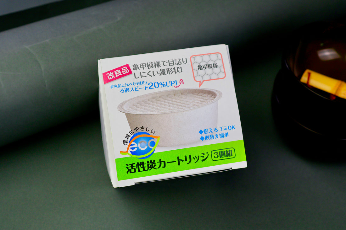top down shot of three pack kitchen fry oil filter made in Japan carbon charcoal filters with grey background