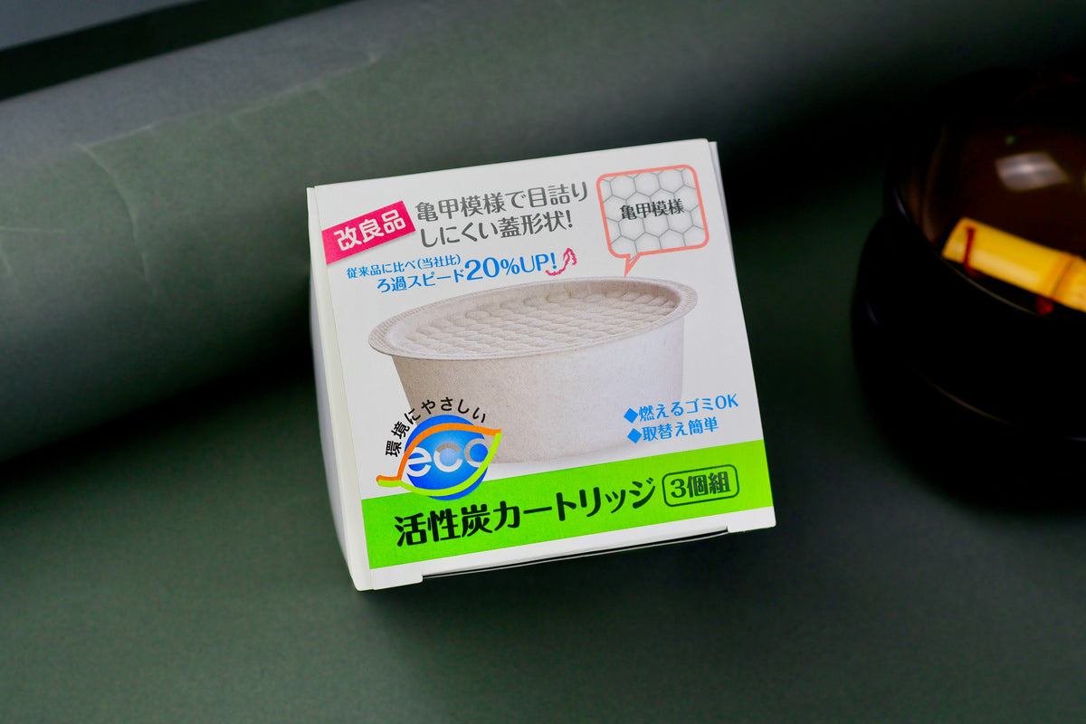top down shot of three pack kitchen fry oil filter made in Japan carbon charcoal filters with grey background