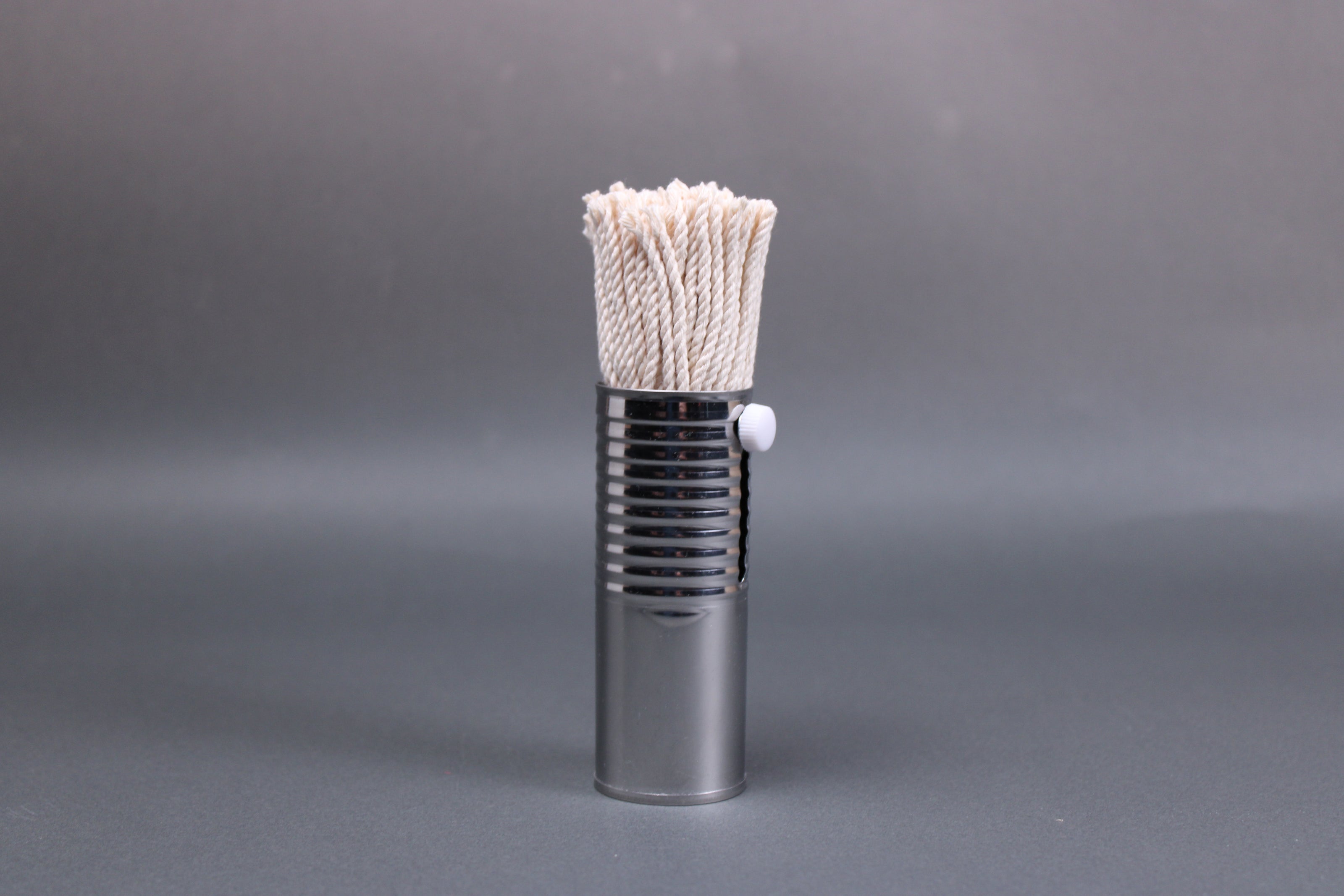 upright shot of metal housed cotton oil brush for pans takoyaki
