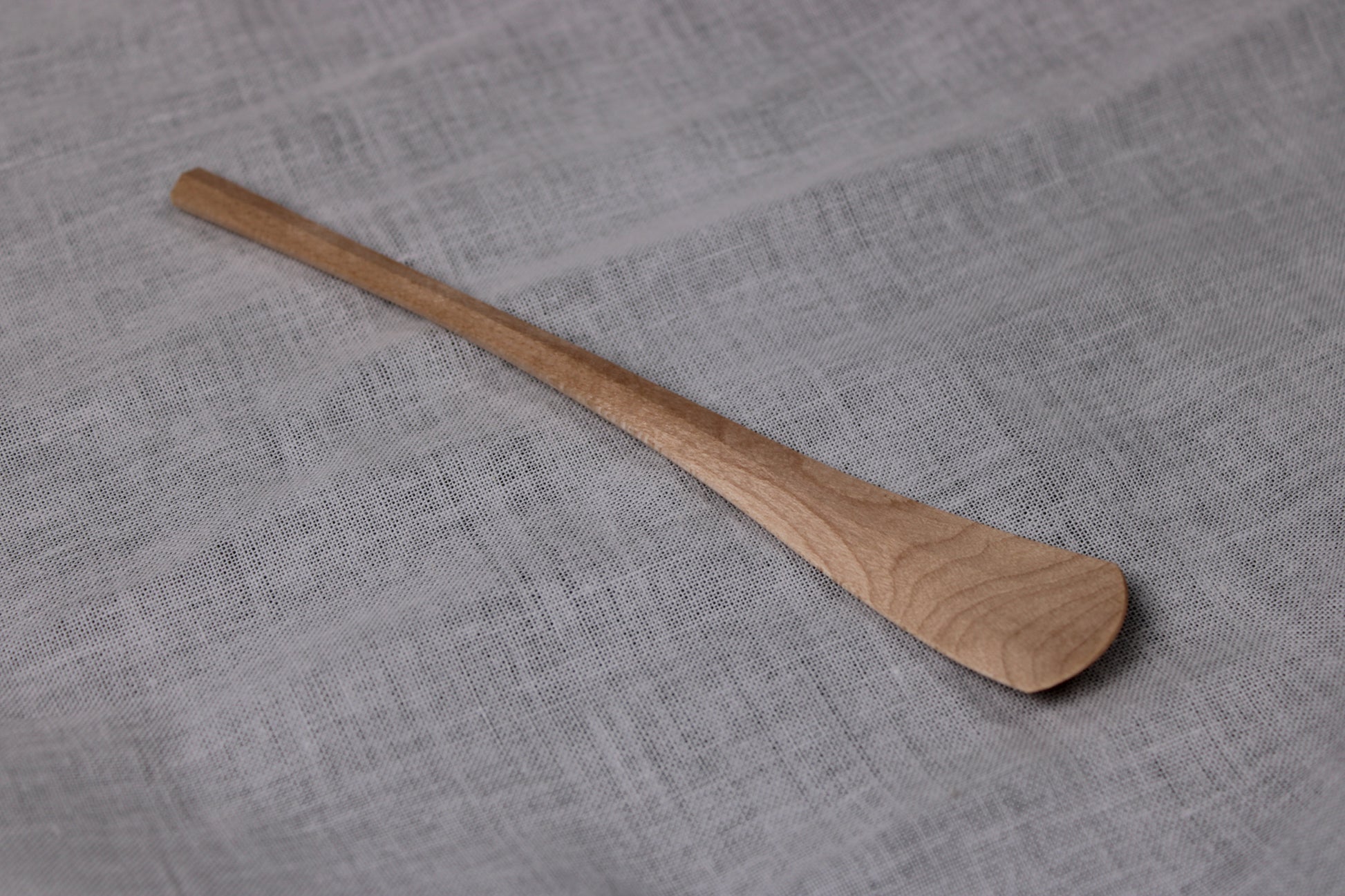 okubo house handmade artisan maple wood spoon made without sanding or filing layed flat with white background