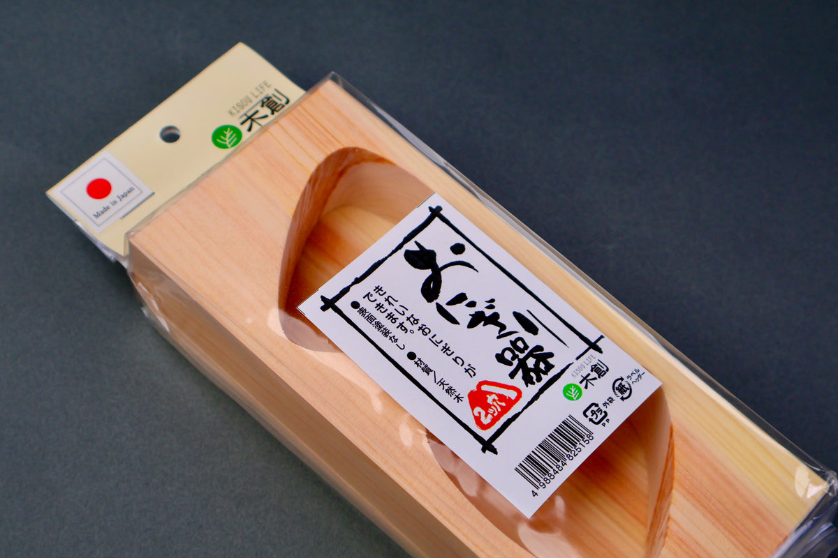 hinoki wood triangle mold for onigiri with two holes and baseplate wrapped in plastic with youbi label