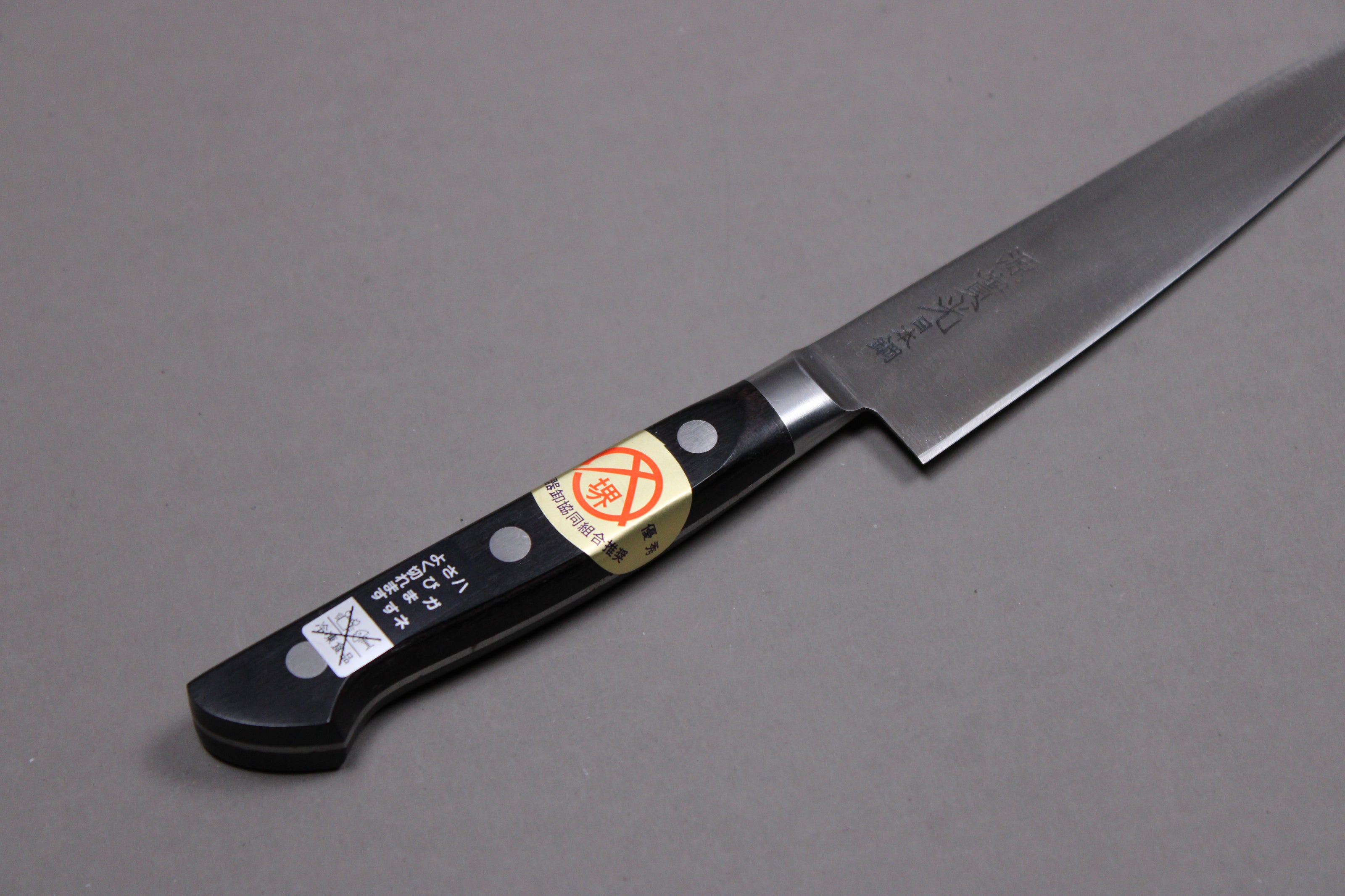  top view petty pakka wood handle and choil of knife 