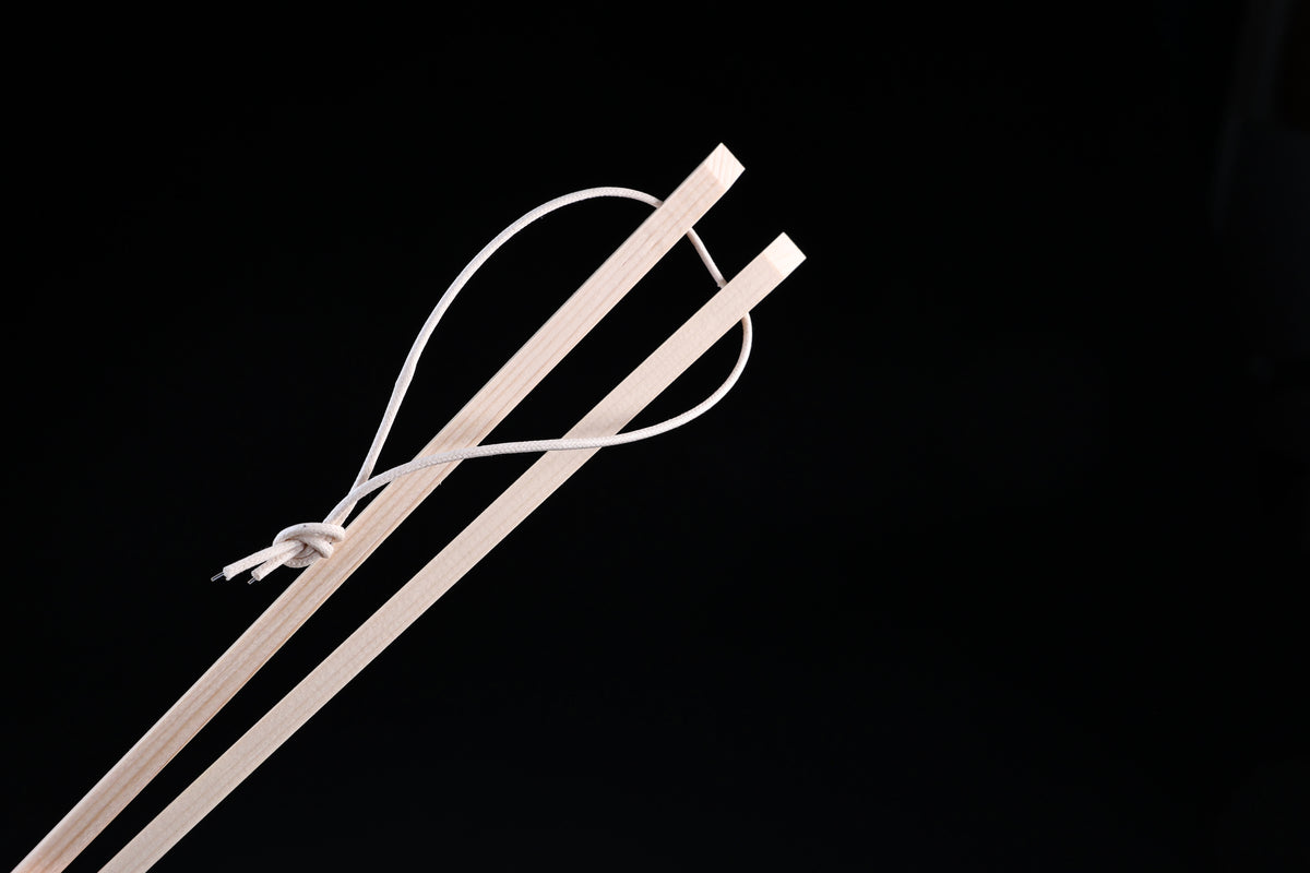 Saibashi square cooking chopsticks — close-up of square handle ends and white hanging cord detail