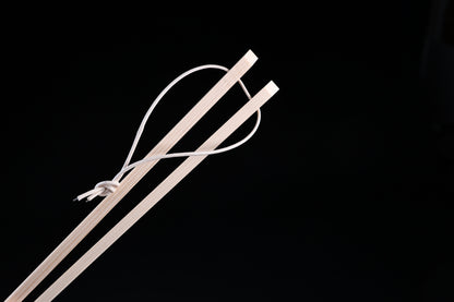 Saibashi square cooking chopsticks — close-up of square handle ends and white hanging cord detail