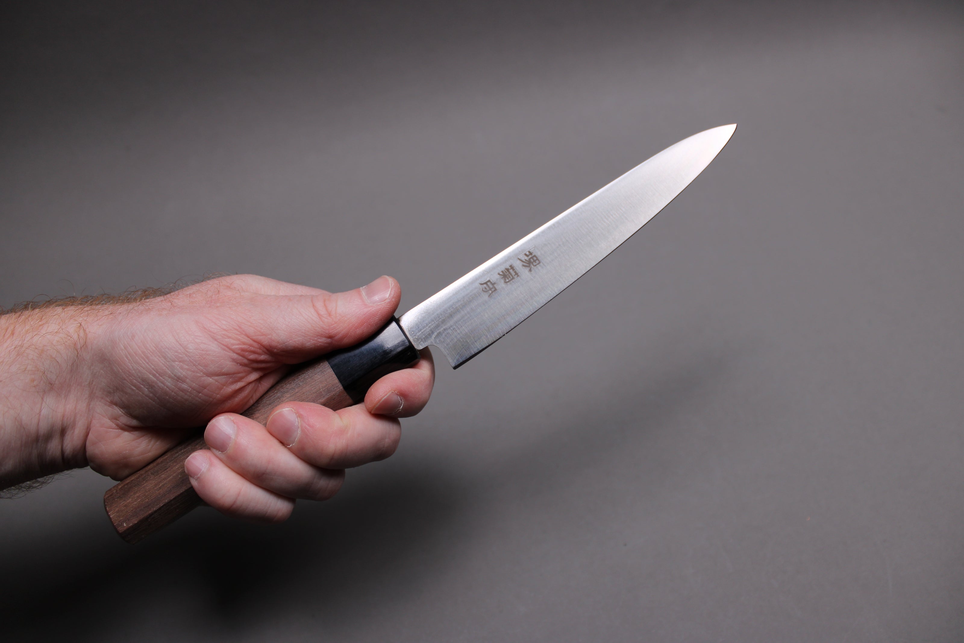 hand holding molybdenum stainless kawamura hamono petty