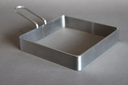 sandwich guide by yamasaki showing stainless steel body with grey bacground