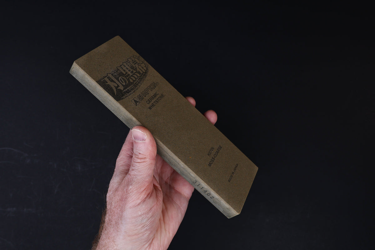 Shapton Kuromaku #220 ceramic whetstone — side profile showing stone thickness and spine label