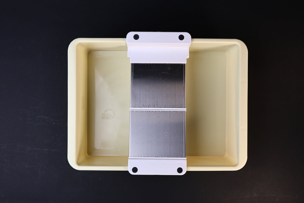Sharpening station kit — close-up of adjustable stone holder platform and bracket detail in tray
