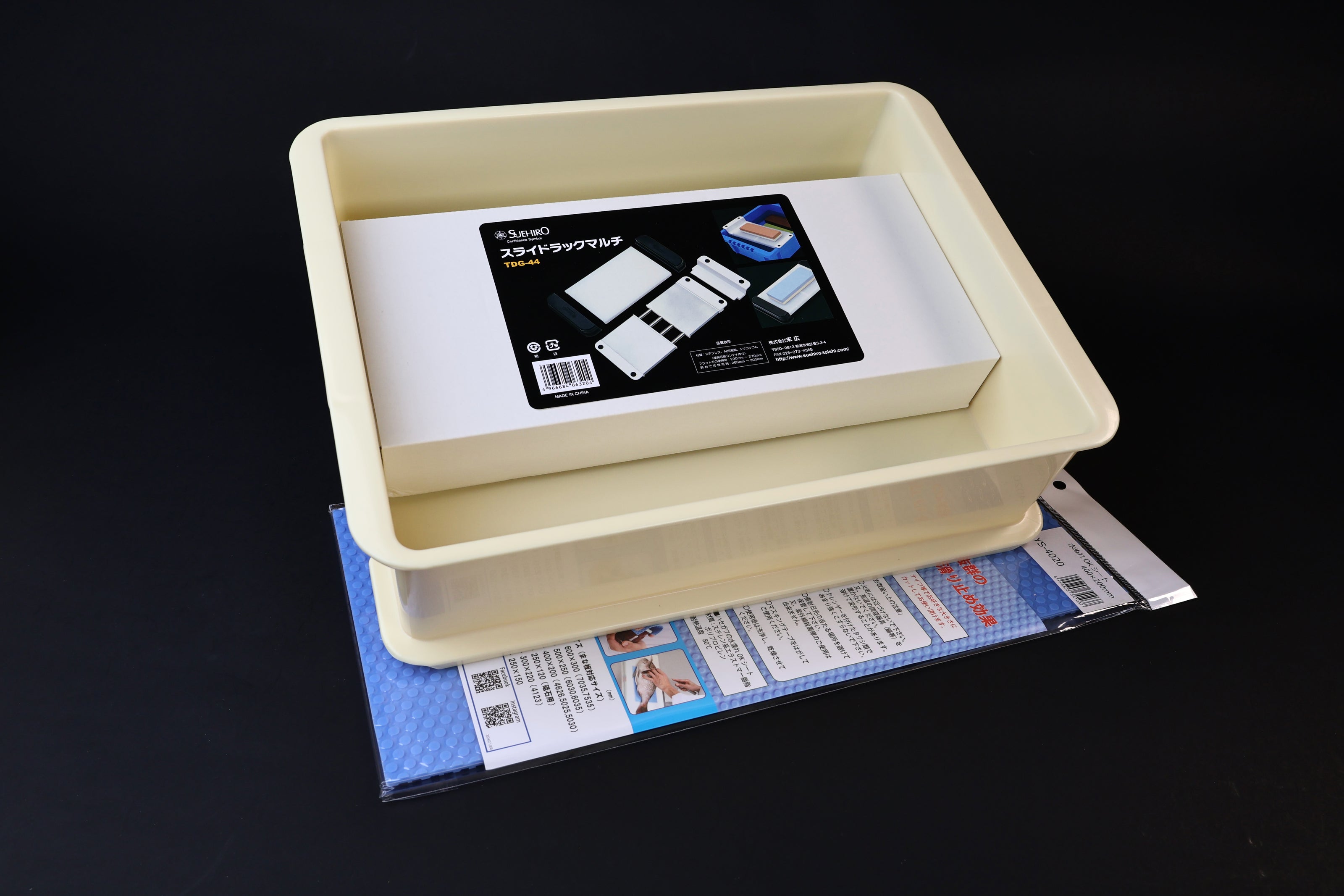 Sharpening station kit — top-down view of stone holder installed in soaking tray