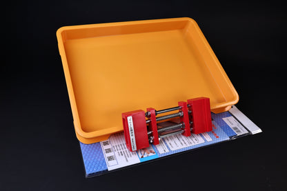 Sharpening Station Kit components — orange tray, red adjustable whetstone holder, and blue rubber mat packaging