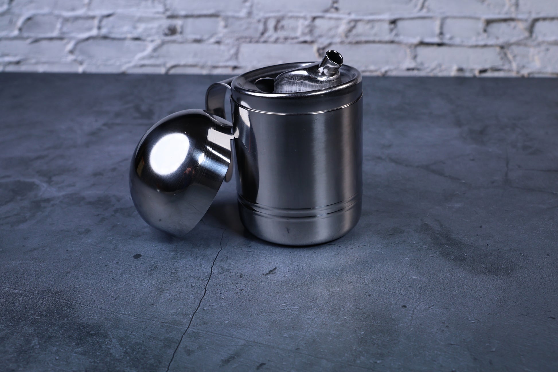 Stainless steel oil cruet small — front view lid removed showing inner spout detail and brushed steel body